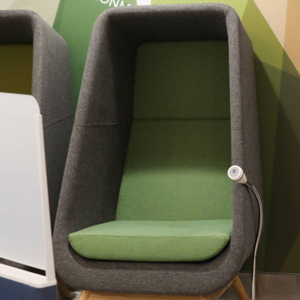 grey and green chair with table at belfast city airport